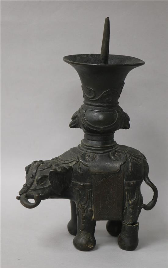 A 19th century Chinese bronze elephant pricket candlestick, damaged